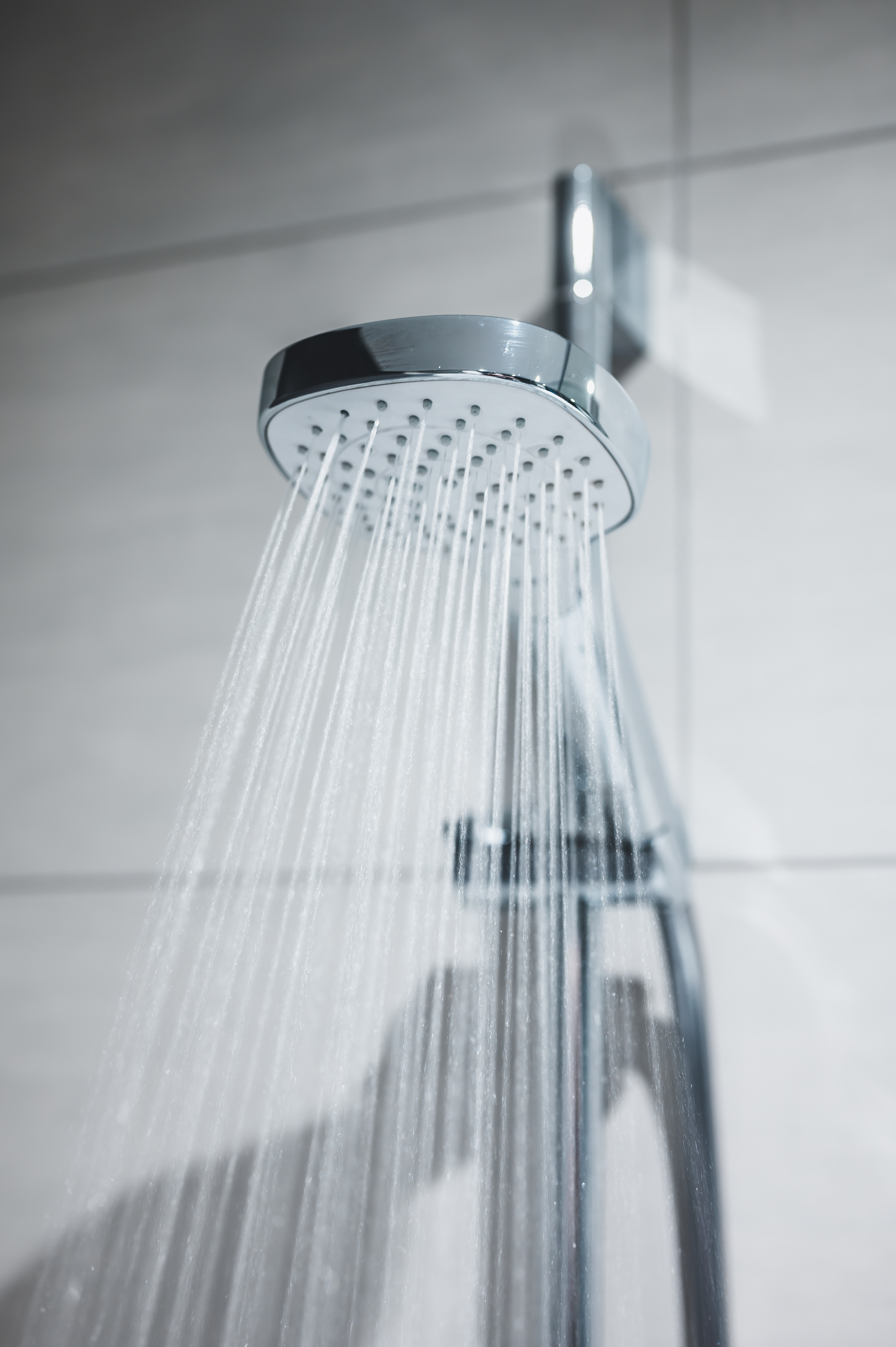 A clean shower head with soft water in Charlotte.