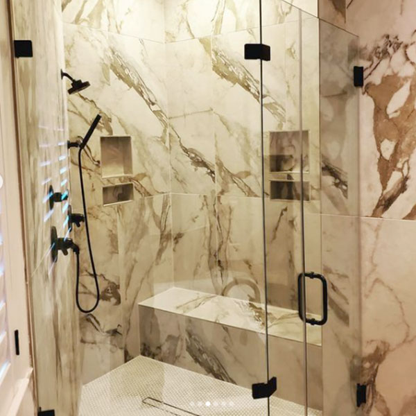 A Footprints Floors of The Valley marble tile shower installation.