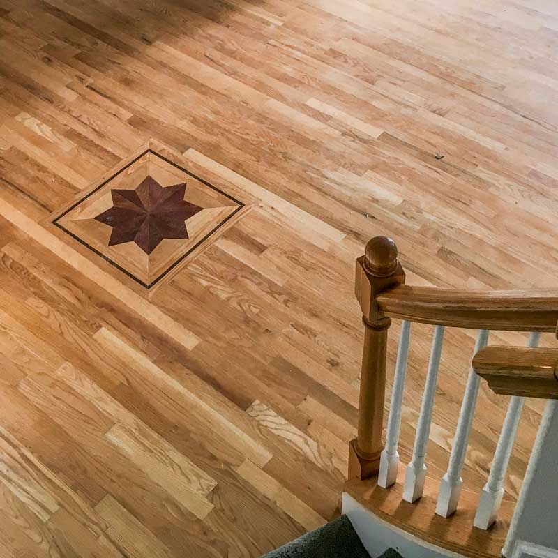 This beautiful and intricate hardwood flooring was installed by  Footprints Floors  professionals.