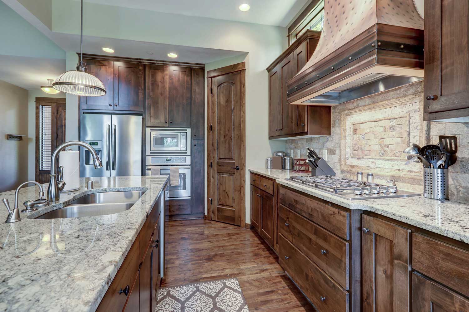 Beautiful stone bathroom backsplash installation in Savannah with Footprints Floors.