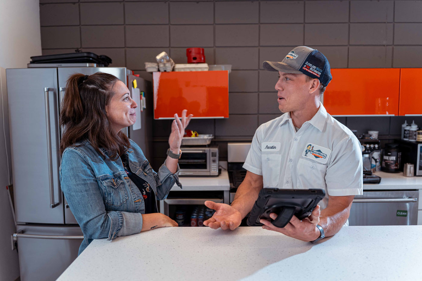 A WyattWorks team member talking to a homeowner and providing services in Ohio & North Carolina, {fran_state_abbrev}.
