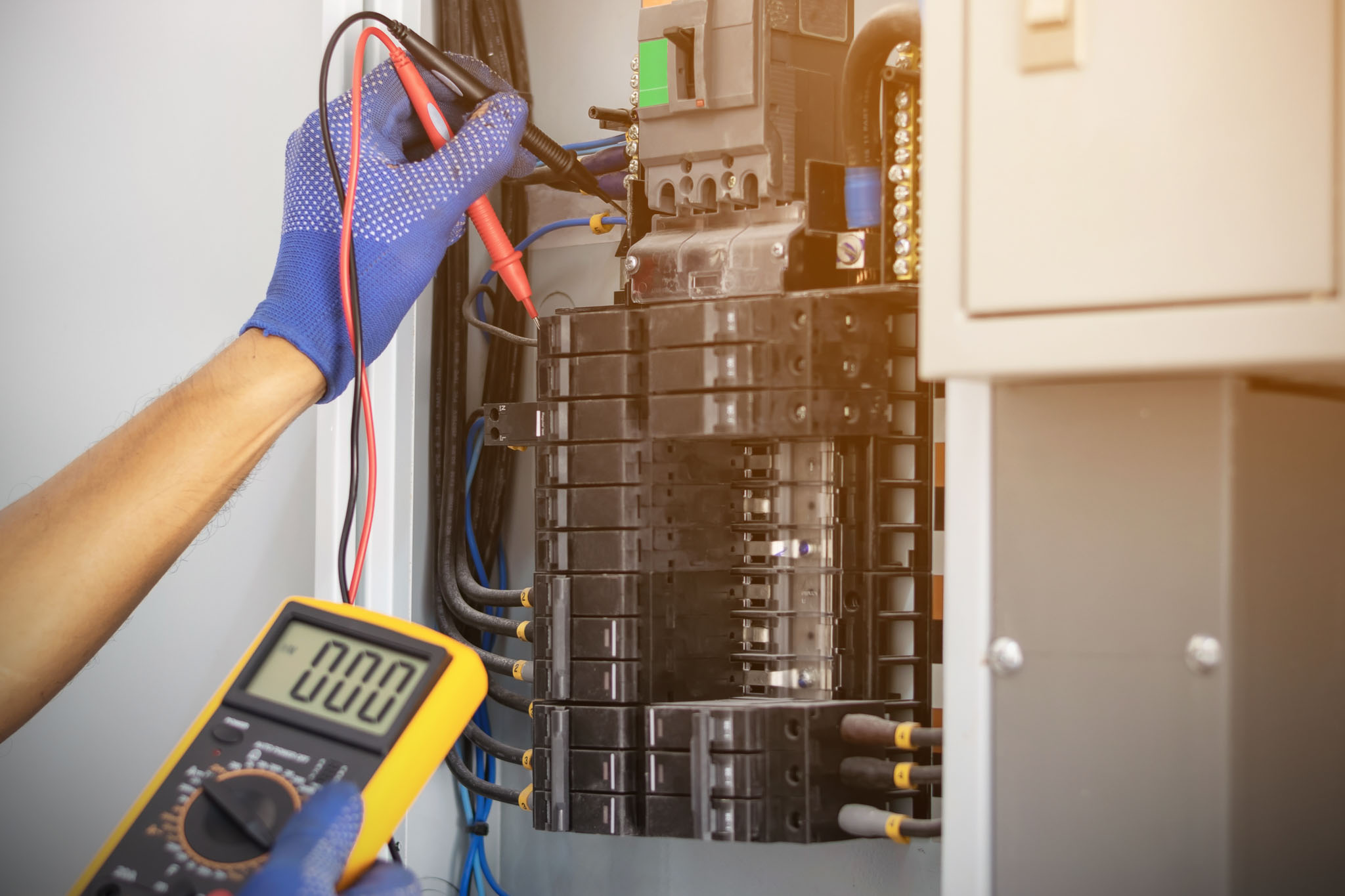 A circuit board being serviced by a WyattWorks electrician.