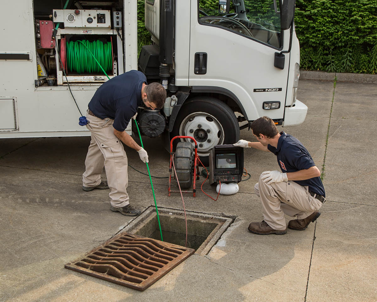 WyattWorks team members performing rooter services to clear blockages.
