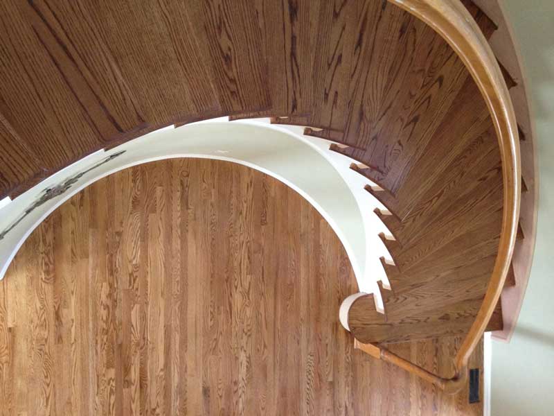 This beautiful spiral staircase was refinished by Footprints Floors .