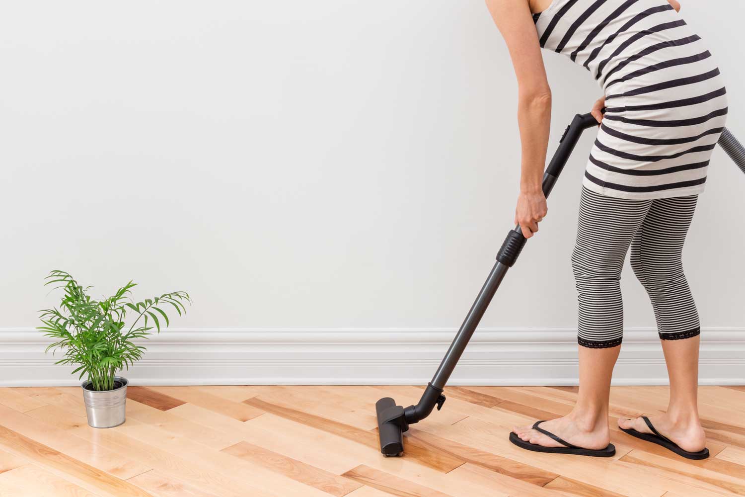 Regulary vacuum or sweep floors to remove dirt and keep your home floors looking amazing - tips from Footprints Floors in Waukesha / New Berlin.