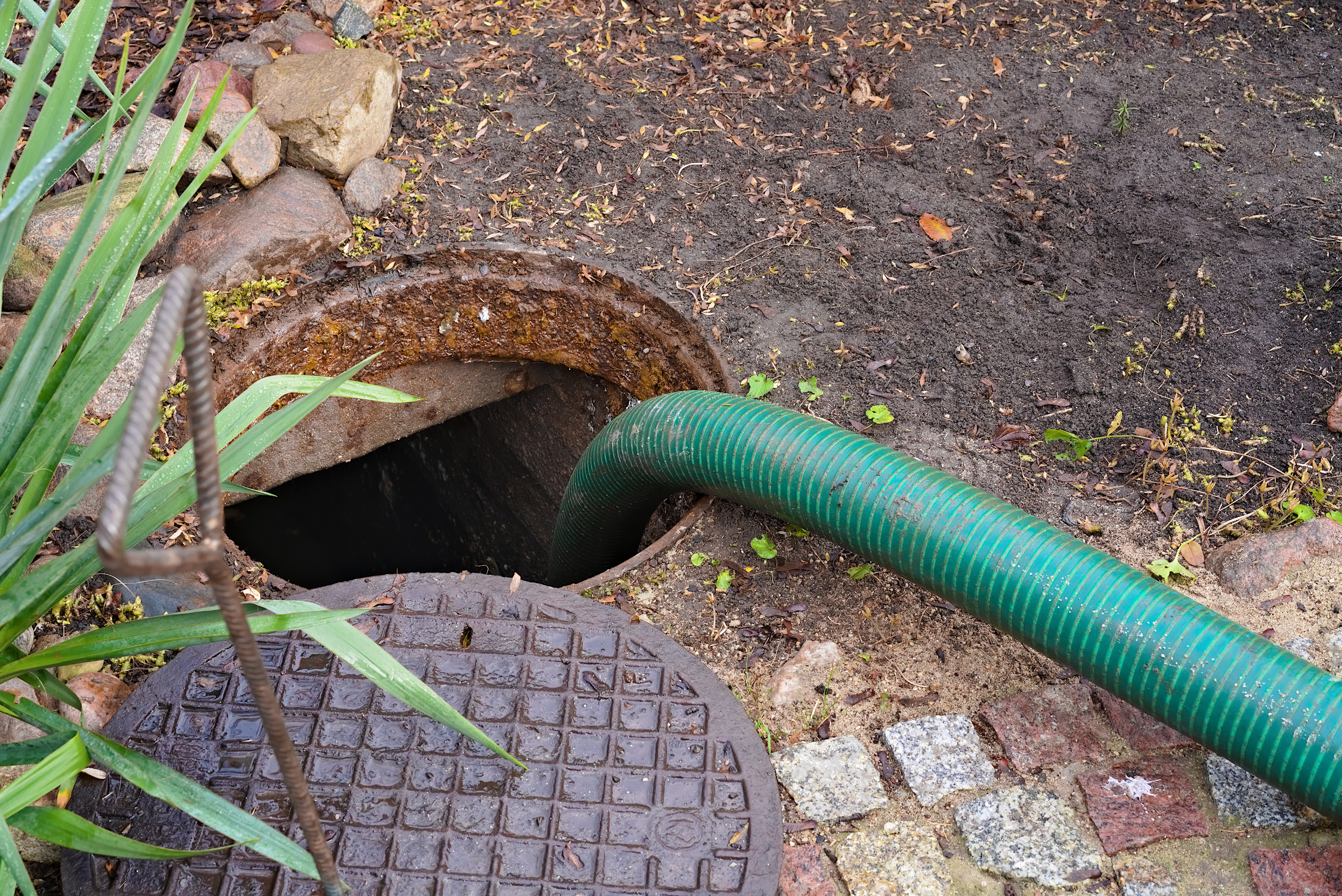 A drain going down to a septic tank - contact WyattWorks for expert septic system pumping in Ohio & North Carolina, {fran_state_abbrev}.