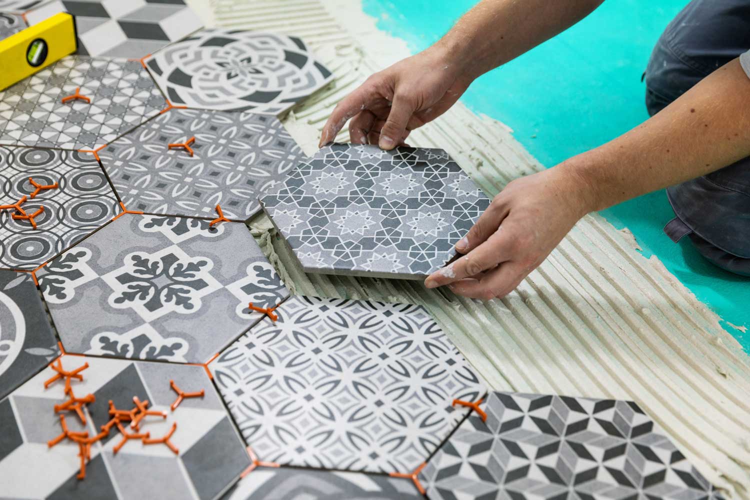 Patterned Tiles being layed by Footprints Floors in Miami / Broward.