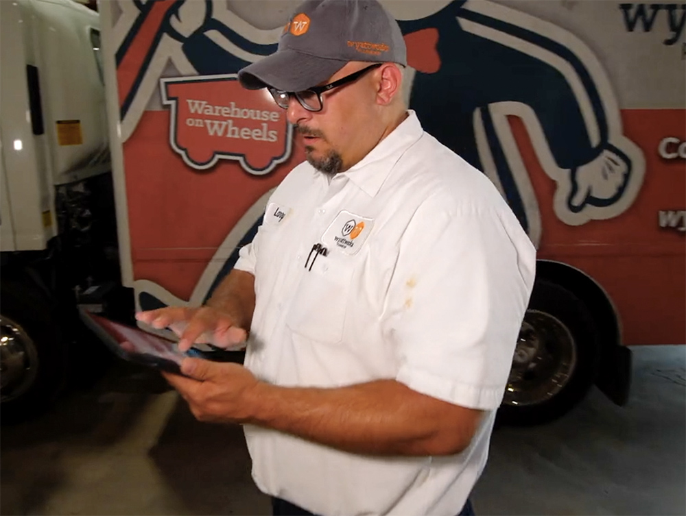 A WyattWorks team member preparing to service a sump pump.
