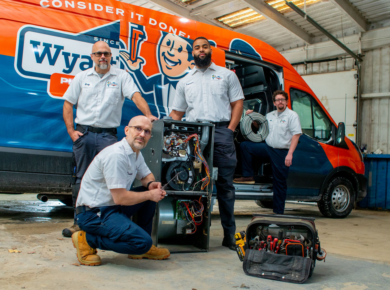 The WyattWorks team posing in front of a company truck - one of the top plumbing and home service companies in Ohio & North Carolina, {fran_state_abbrev}.