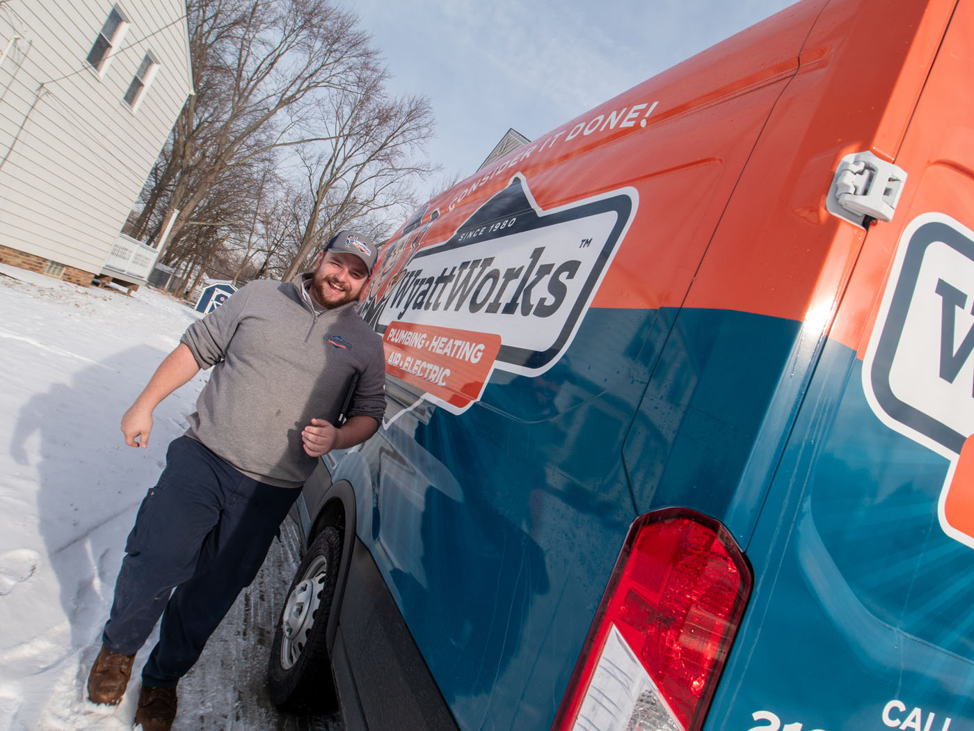 A WyattWorks Plumbing contractor outside of a branded van - call WyattWorks, the top rooter plumbing in Ohio & North Carolina, {fran_state_abbrev}.